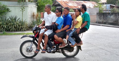 Some creative Filipinos showing you don't need a van to fit your entire family.